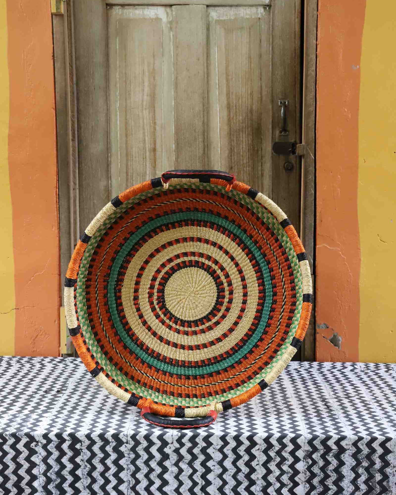 Handwoven wall tray in elephant grass from Bolgatanga, Ghana, woven in a double weave.