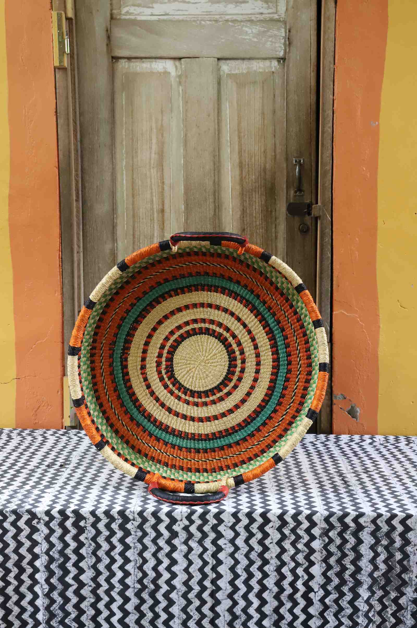 Handwoven wall tray in elephant grass from Bolgatanga, Ghana, woven in a double weave.
