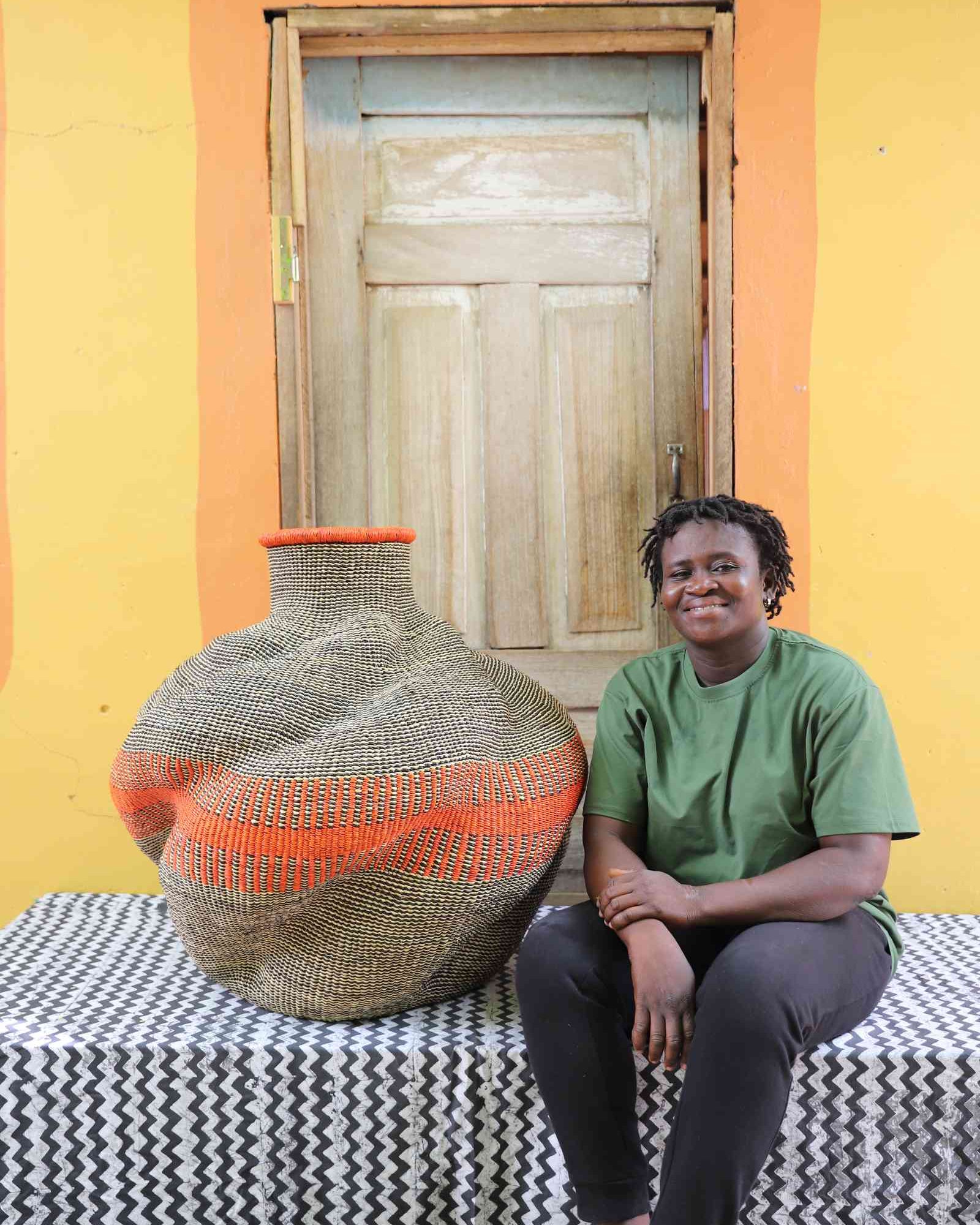 Large De-engo handwoven Bolga basket displayed as bold home Décor