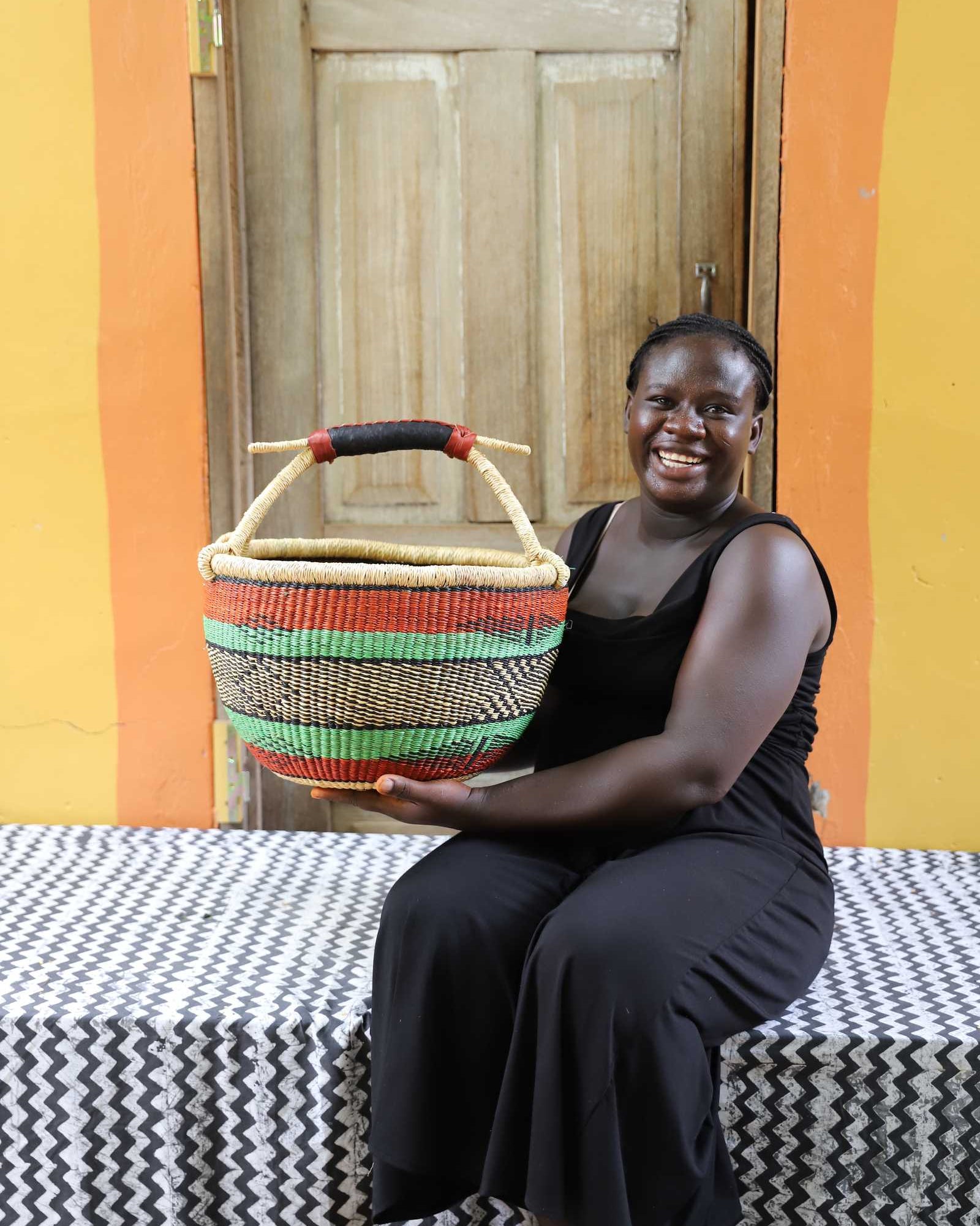 Handwoven African basket in elephant grass, round and open, 38 cm across.