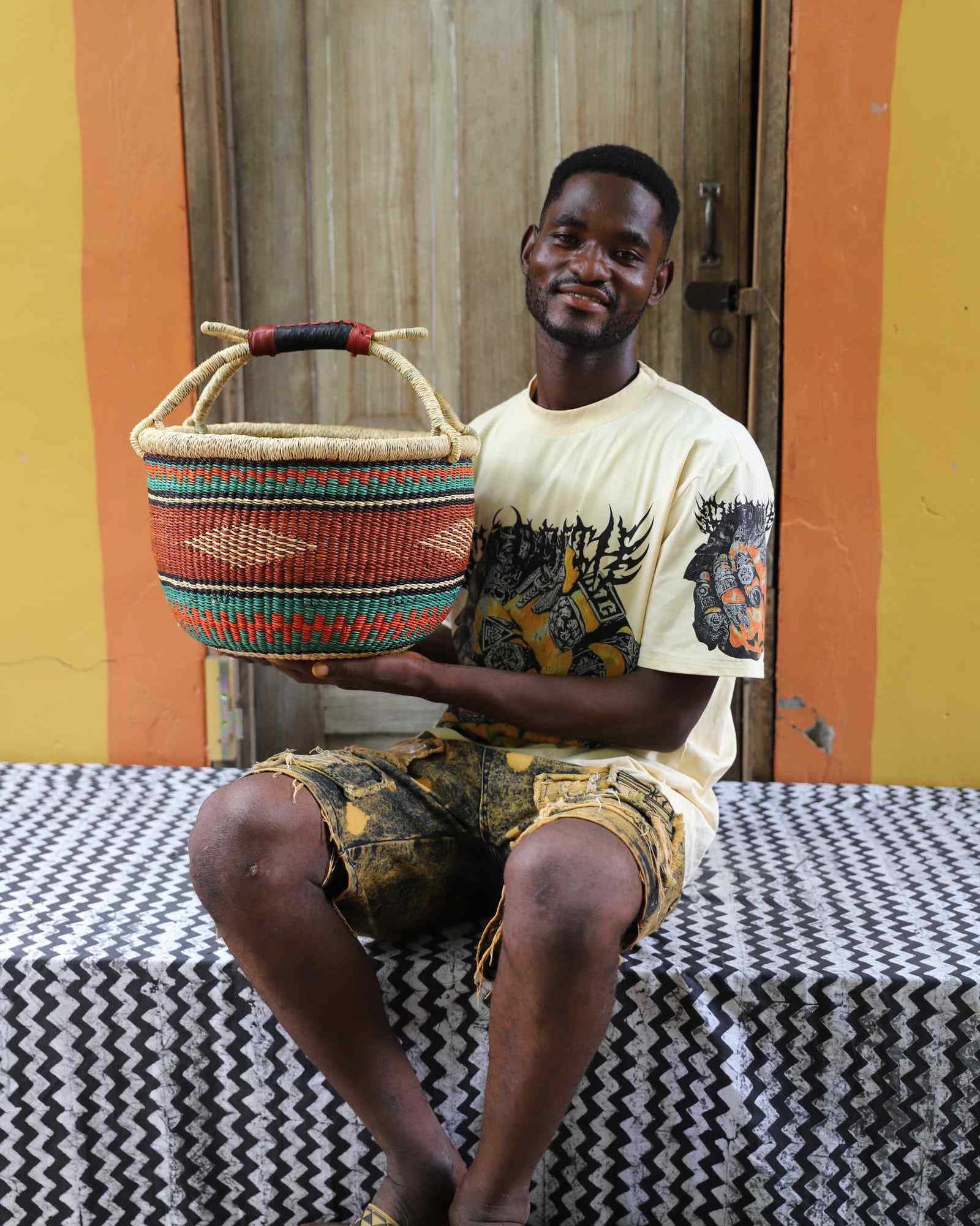 Handwoven Bolga basket in elephant grass, round form scaled for a market run.