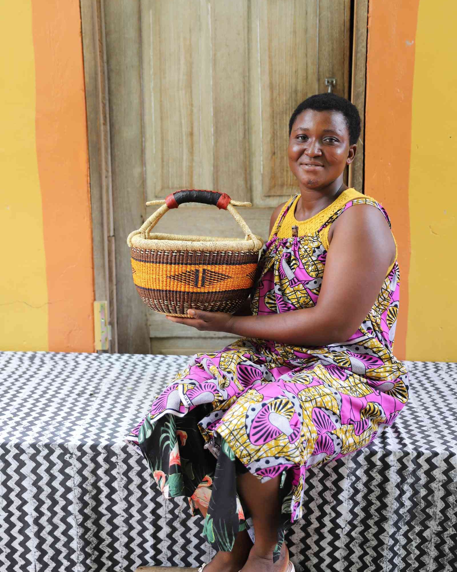 Small handwoven Bolga basket in elephant grass, the original round Bolgatanga form.