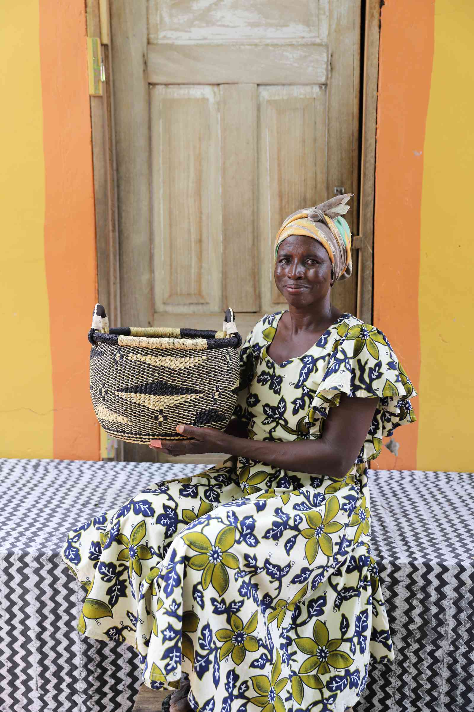 Handwoven Bolga storage basket in elephant grass, based on the traditional pito sieve.