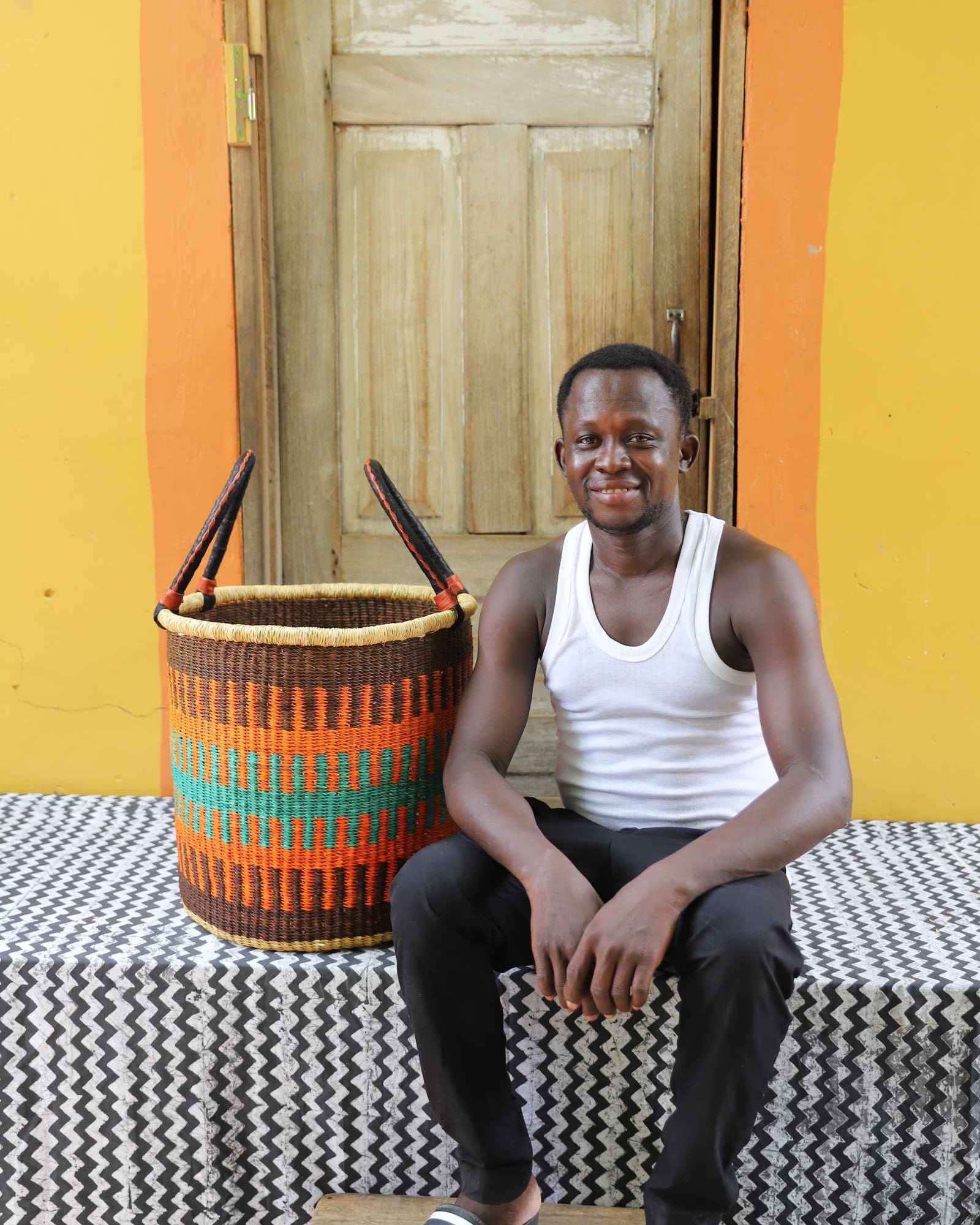 Handwoven African basket for towels and throws, woven in elephant grass.