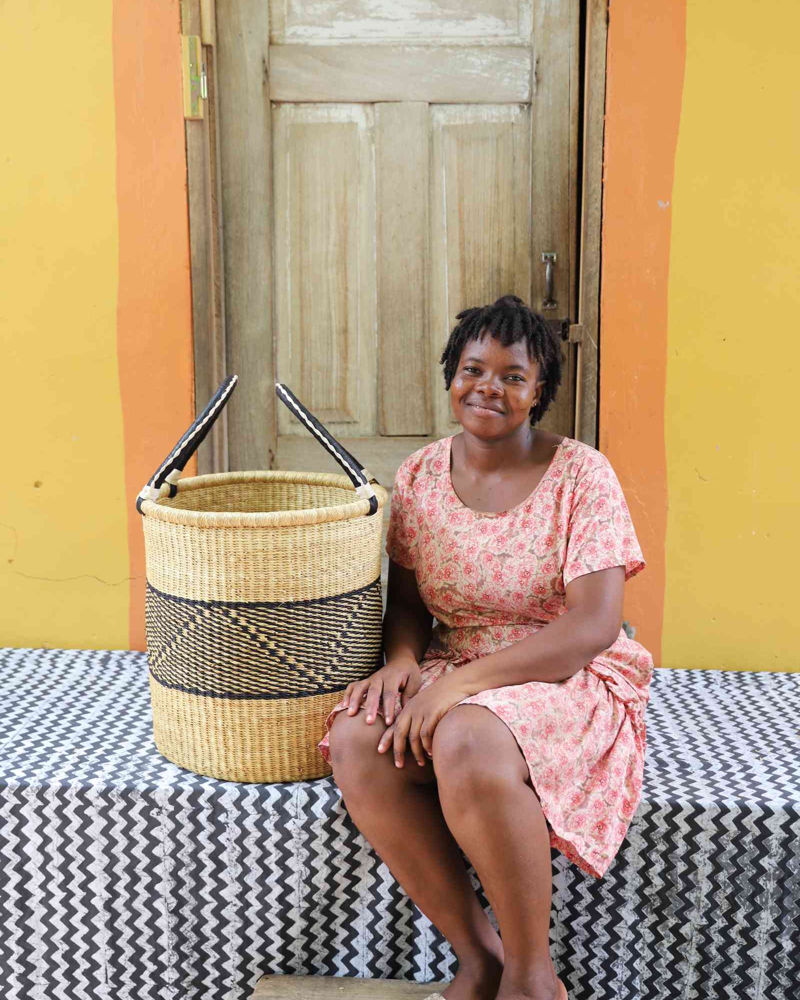 Handwoven Bolga basket with an open top, sized for a bedroom or bathroom.
