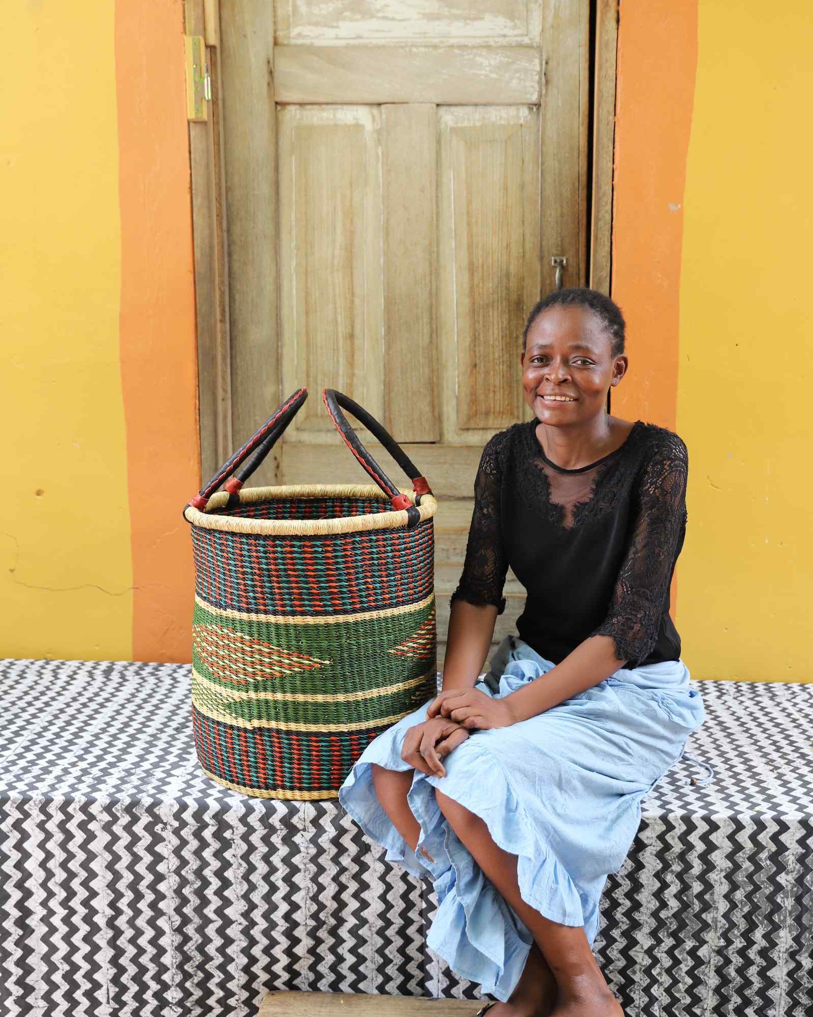Open laundry basket handwoven in elephant grass, 46 cm tall.