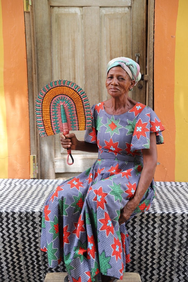 The Baba Tree Bolga Original Fan: Handwoven architectural wall art with intricate weave and premium leather handle.
