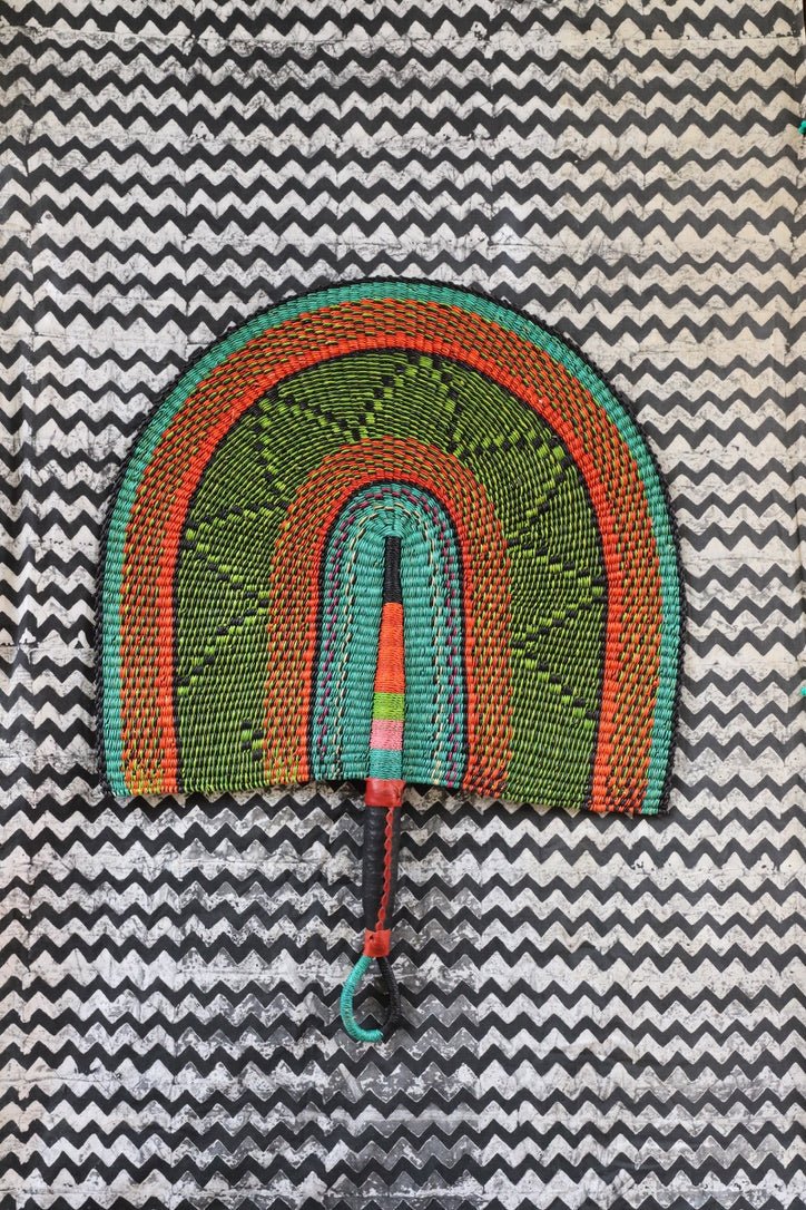 Naba Pengo Fan by The Baba Tree. Premium handwoven elephant grass wall art and artisanal Bolgatanga home decor.