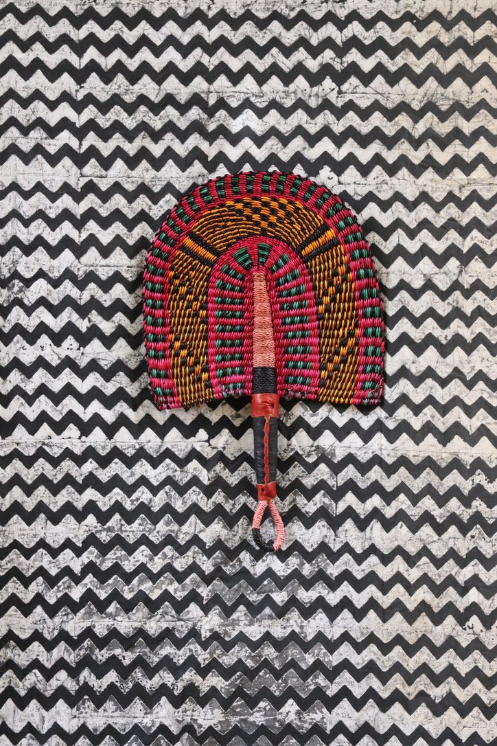 The Baba Tree Bolga Original Fan: Handwoven architectural wall art with intricate weave and premium leather handle.