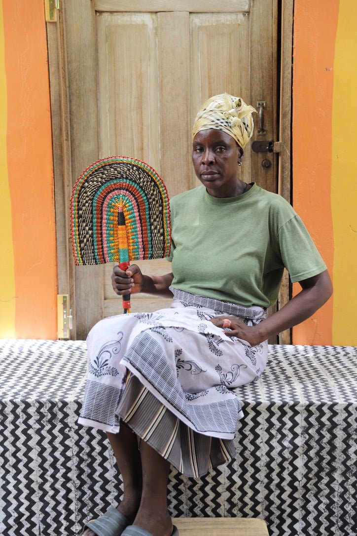 The Baba Tree Bolga Original Fan: Handwoven architectural wall art with intricate weave and premium leather handle.