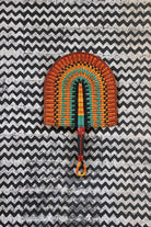 The Baba Tree Bolga Original Fan: Handwoven architectural wall art with intricate weave and premium leather handle.