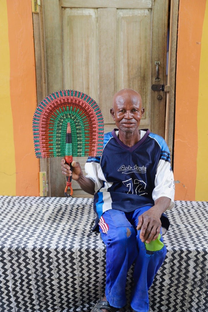 The Baba Tree Bolga Original Fan: Handwoven architectural wall art with intricate weave and premium leather handle.