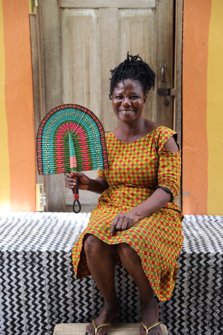 The Baba Tree Bolga Original Fan: Handwoven architectural wall art with intricate weave and premium leather handle.