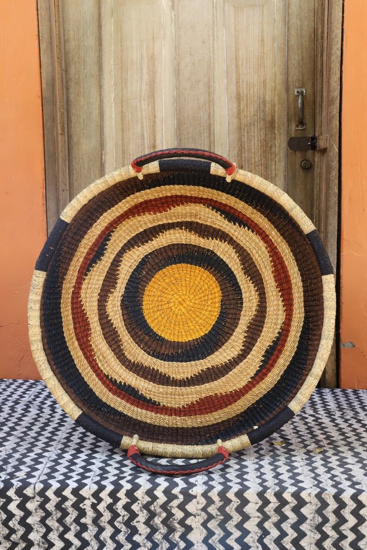 Premium elephant grass tray with leather handles. Bolgatanga artisan craftsmanship.