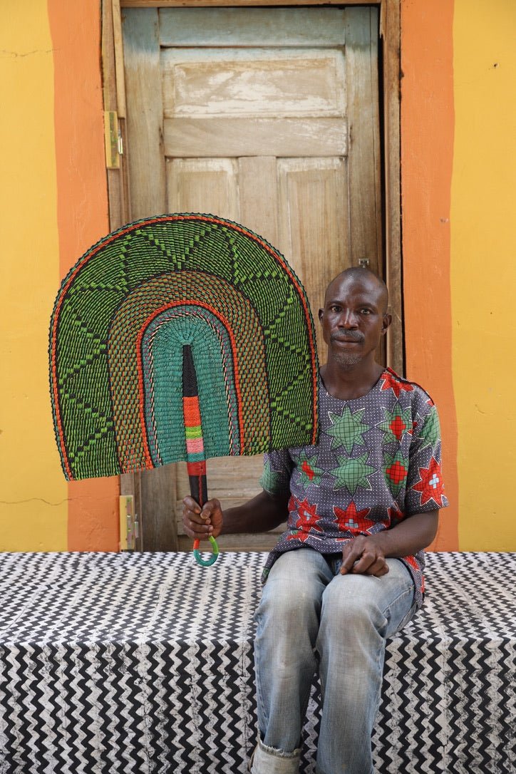 Naba Pengo Fan by The Baba Tree. Premium handwoven elephant grass wall art and artisanal Bolgatanga home decor.