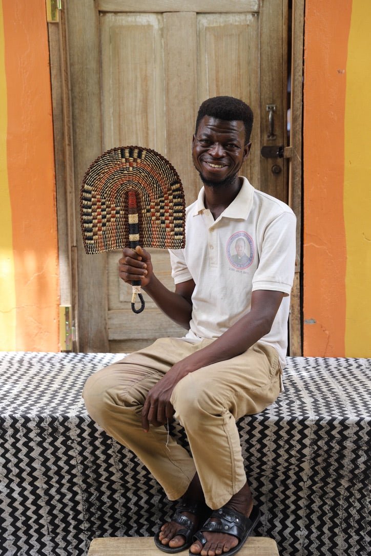 The Baba Tree Bolga Original Fan: Handwoven architectural wall art with intricate weave and premium leather handle.