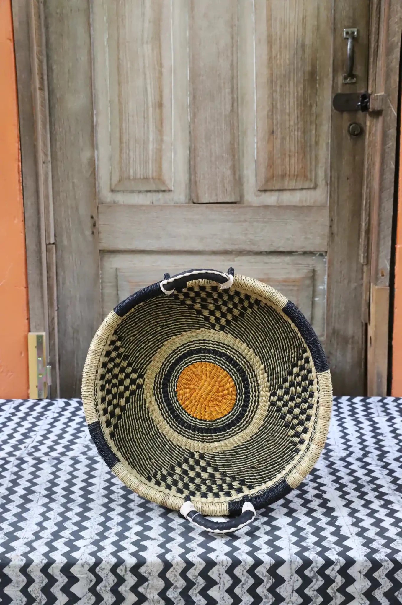Premium elephant grass tray with leather handles. Bolgatanga artisan craftsmanship.