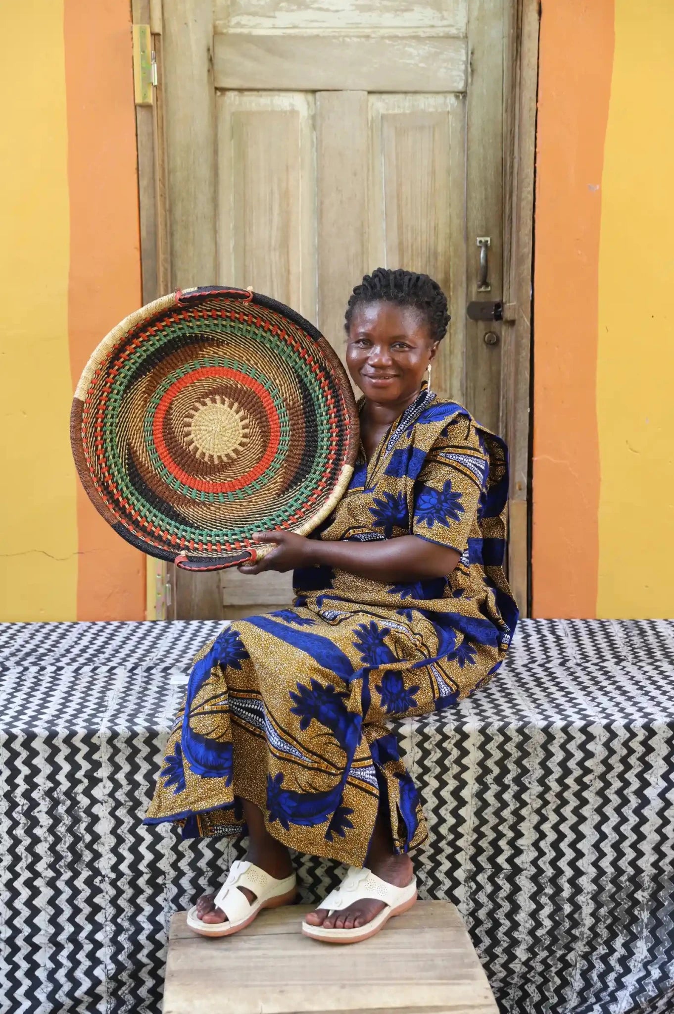 Premium elephant grass tray with leather handles. Bolgatanga artisan craftsmanship.