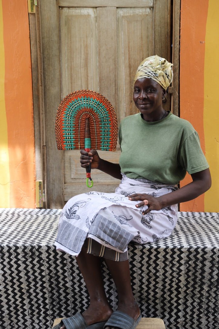 The Baba Tree Bolga Original Fan: Handwoven architectural wall art with intricate weave and premium leather handle.