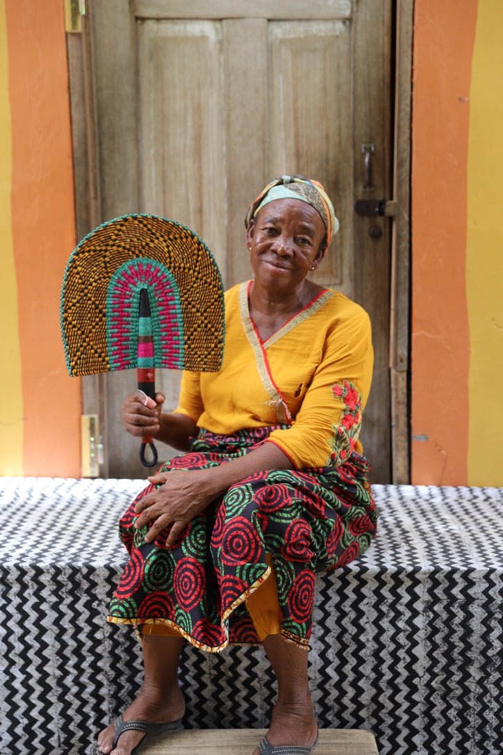 The Baba Tree Bolga Original Fan: Handwoven architectural wall art with intricate weave and premium leather handle.