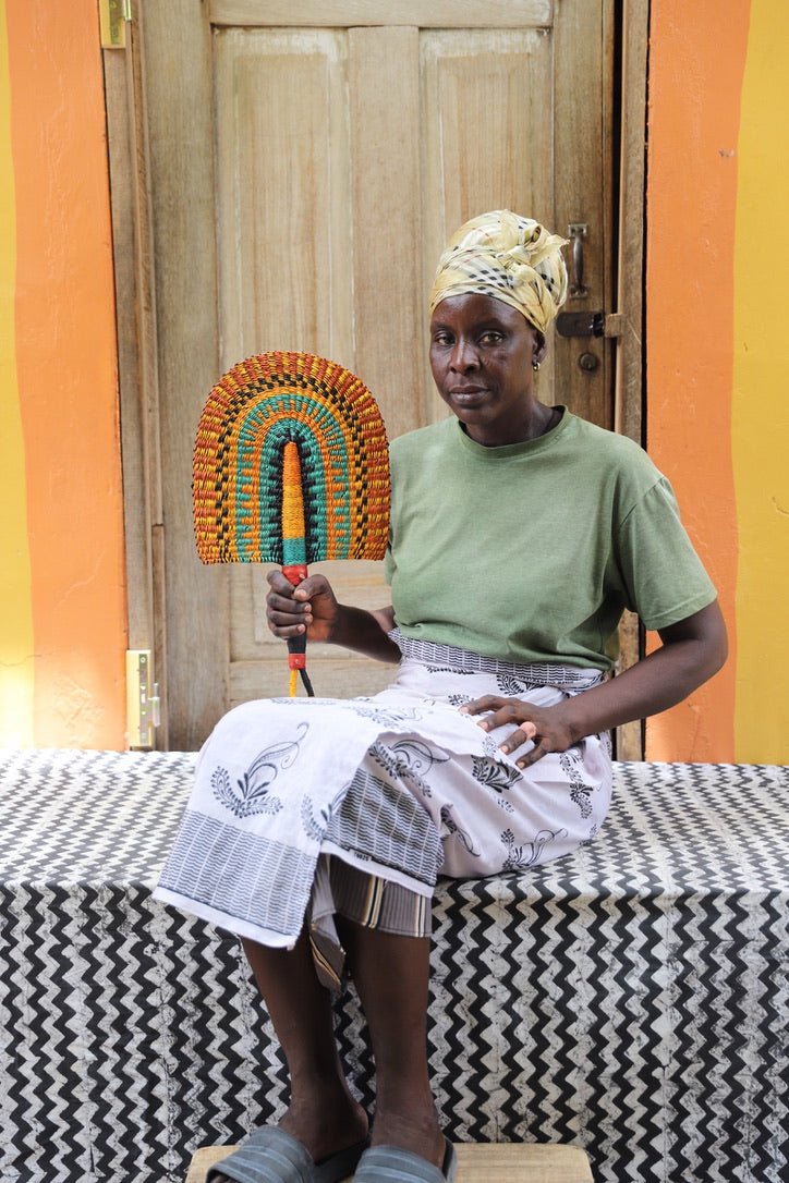 The Baba Tree Bolga Original Fan: Handwoven architectural wall art with intricate weave and premium leather handle.