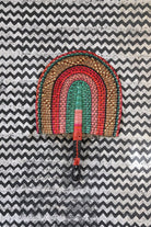 The Baba Tree Bolga Original Fan: Handwoven architectural wall art with intricate weave and premium leather handle.