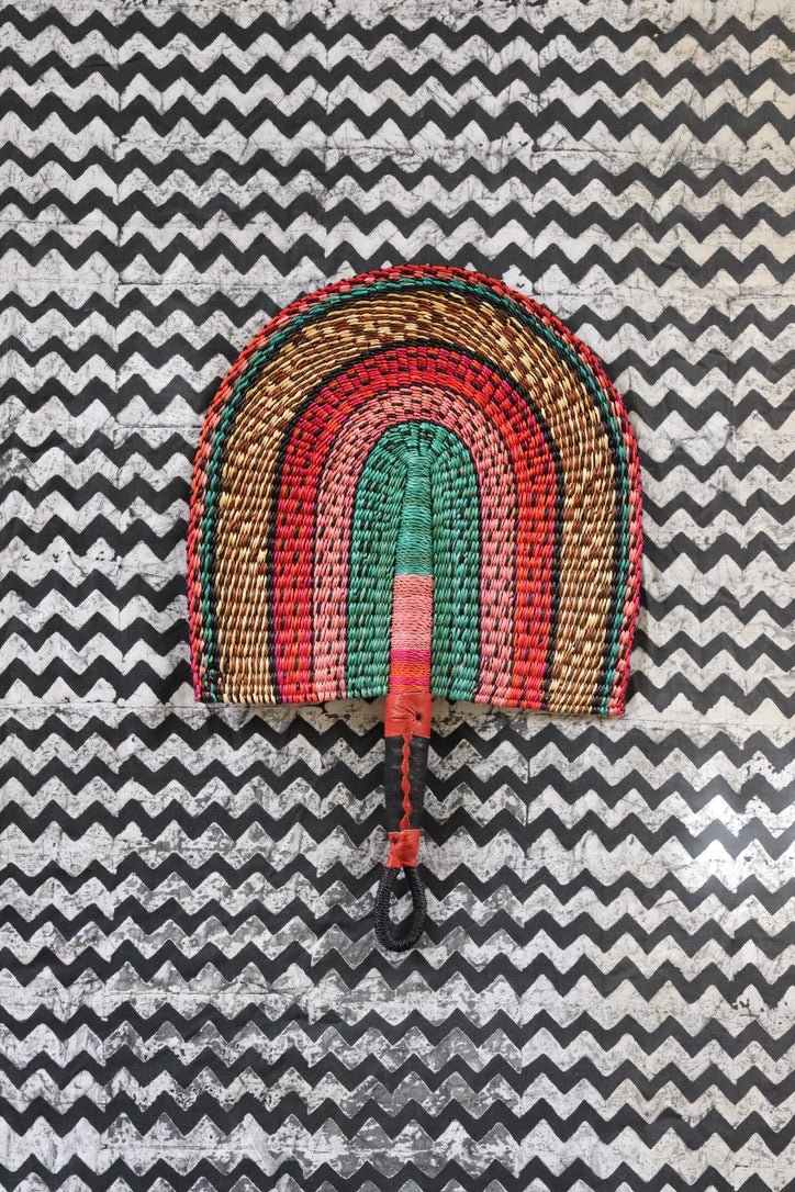 The Baba Tree Bolga Original Fan: Handwoven architectural wall art with intricate weave and premium leather handle.