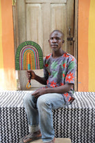 The Baba Tree Bolga Original Fan: Handwoven architectural wall art with intricate weave and premium leather handle.