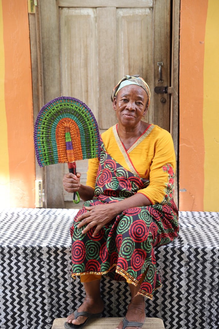 The Baba Tree Bolga Original Fan: Handwoven architectural wall art with intricate weave and premium leather handle.