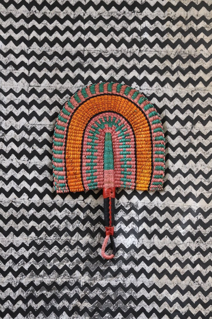 The Baba Tree Bolga Original Fan: Handwoven architectural wall art with intricate weave and premium leather handle.