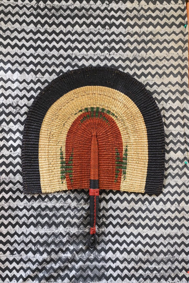 Naba Pengo Fan by The Baba Tree. Premium handwoven elephant grass wall art and artisanal Bolgatanga home decor.