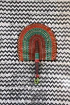 The Baba Tree Bolga Original Fan: Handwoven architectural wall art with intricate weave and premium leather handle.