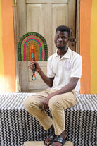 The Baba Tree Bolga Original Fan: Handwoven architectural wall art with intricate weave and premium leather handle.