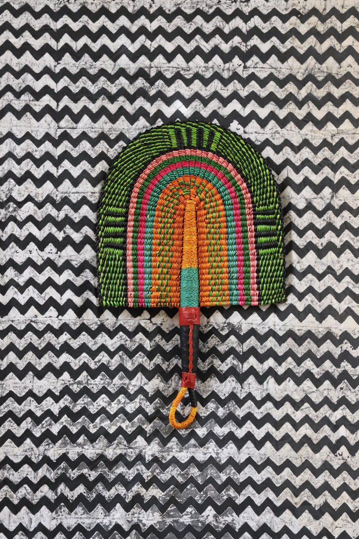 The Baba Tree Bolga Original Fan: Handwoven architectural wall art with intricate weave and premium leather handle.