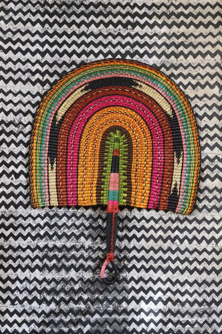 Naba Pengo Fan by The Baba Tree. Premium handwoven elephant grass wall art and artisanal Bolgatanga home decor.