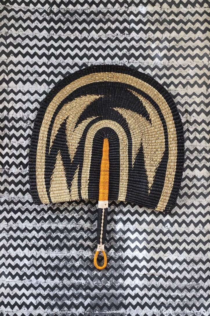 Naba Pengo Fan by The Baba Tree. Premium handwoven elephant grass wall art and artisanal Bolgatanga home decor.