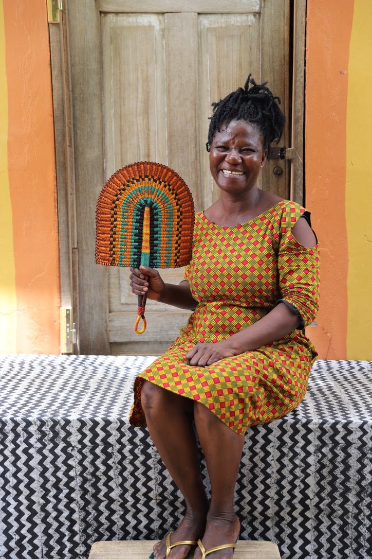 The Baba Tree Bolga Original Fan: Handwoven architectural wall art with intricate weave and premium leather handle.