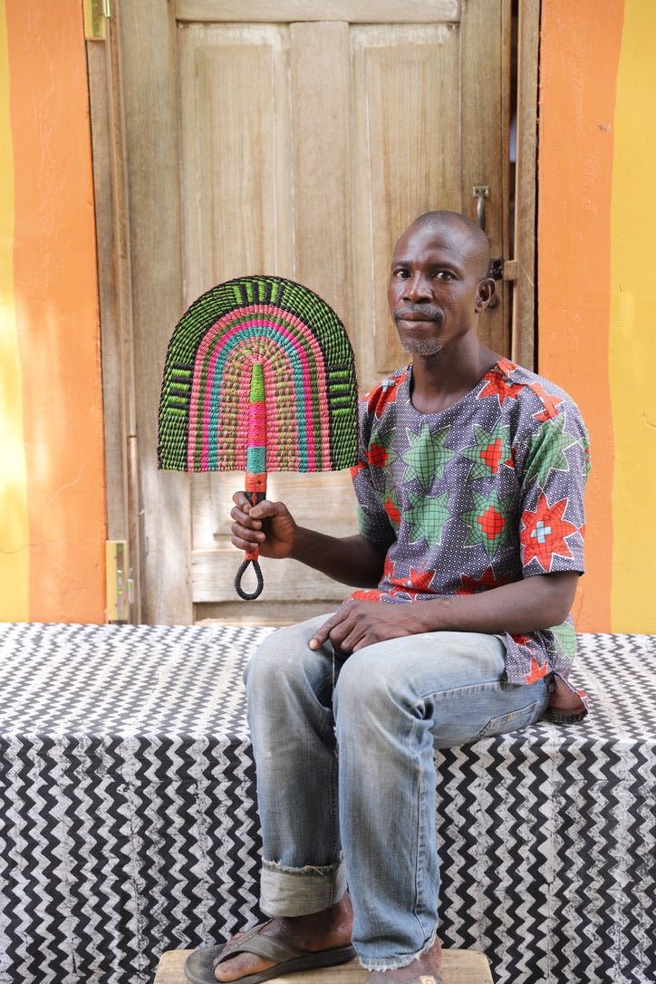 The Baba Tree Bolga Original Fan: Handwoven architectural wall art with intricate weave and premium leather handle.