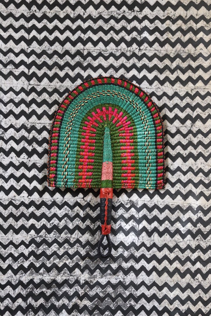 The Baba Tree Bolga Original Fan: Handwoven architectural wall art with intricate weave and premium leather handle.