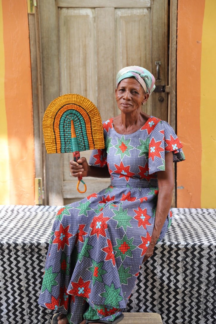 The Baba Tree Bolga Original Fan: Handwoven architectural wall art with intricate weave and premium leather handle.