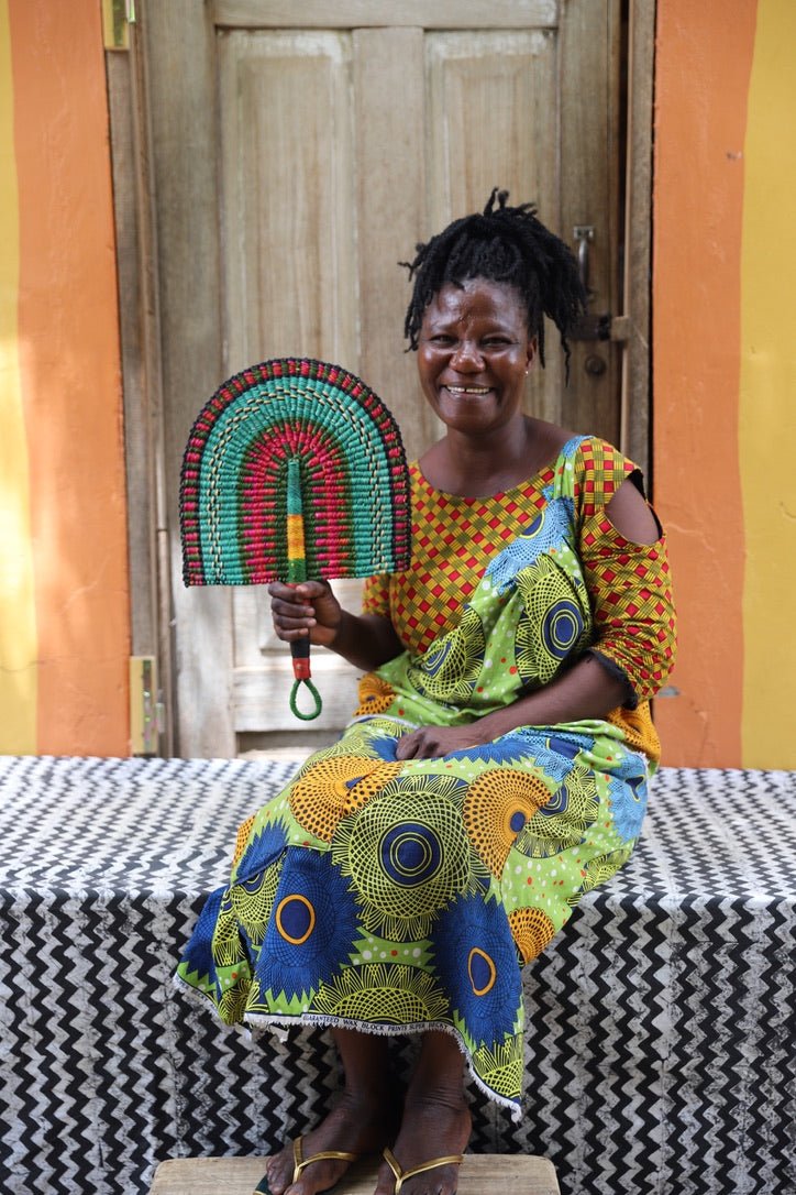 The Baba Tree Bolga Original Fan: Handwoven architectural wall art with intricate weave and premium leather handle.