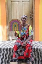 The Baba Tree Bolga Original Fan: Handwoven architectural wall art with intricate weave and premium leather handle.