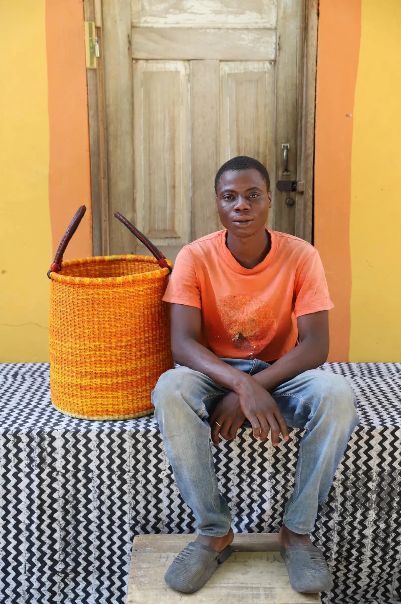 Open Laundry Basket (Small) by The Baba Tree. Handwoven elephant grass storage with leather handles. Bolgatanga artisan decor.