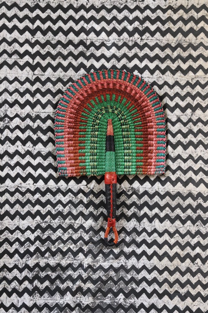 The Baba Tree Bolga Original Fan: Handwoven architectural wall art with intricate weave and premium leather handle.