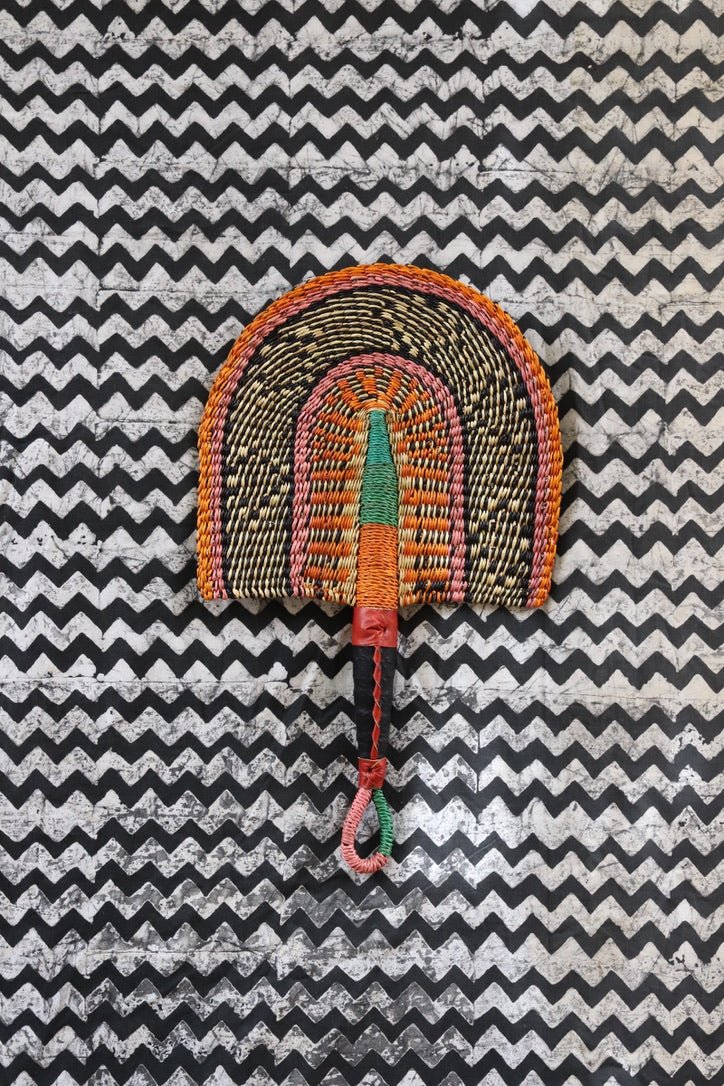 The Baba Tree Bolga Original Fan: Handwoven architectural wall art with intricate weave and premium leather handle.