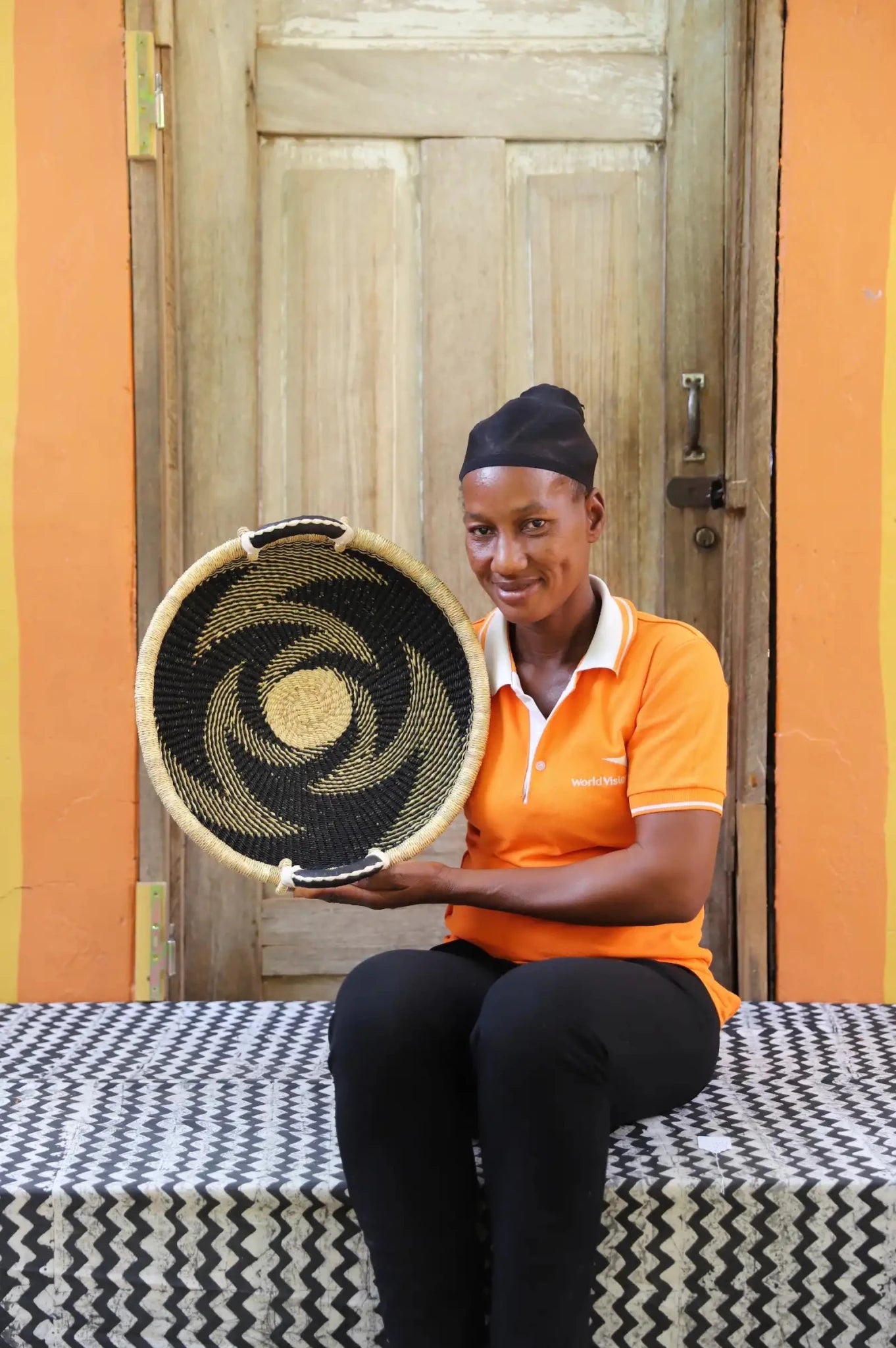 Premium elephant grass tray with leather handles. Bolgatanga artisan craftsmanship.
