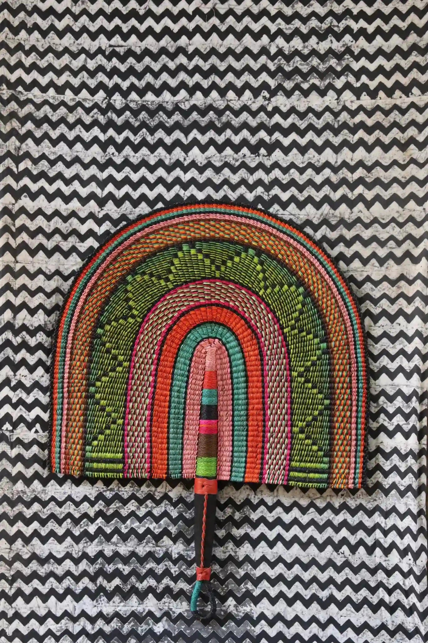 Naba Pengo Fan by The Baba Tree. Premium handwoven elephant grass wall art and artisanal Bolgatanga home decor.
