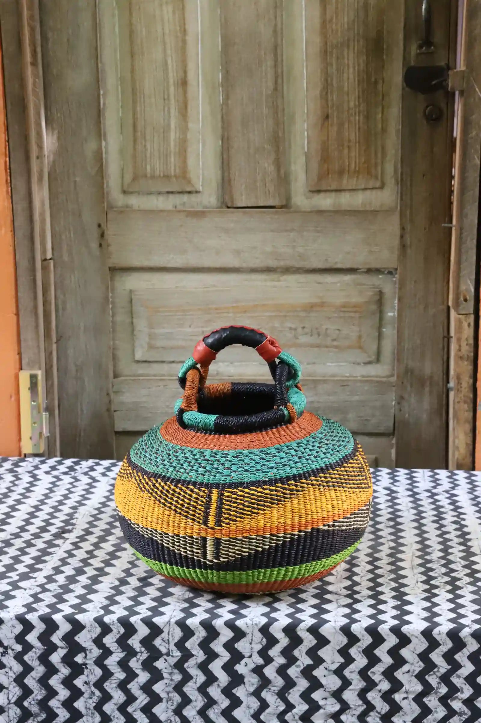 Small pot storage basket with teal dome and black, yellow and lime green body