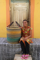 Open Laundry Basket (Large) by The Baba Tree. Handwoven elephant grass storage with leather handles. Bolgatanga artisan decor.