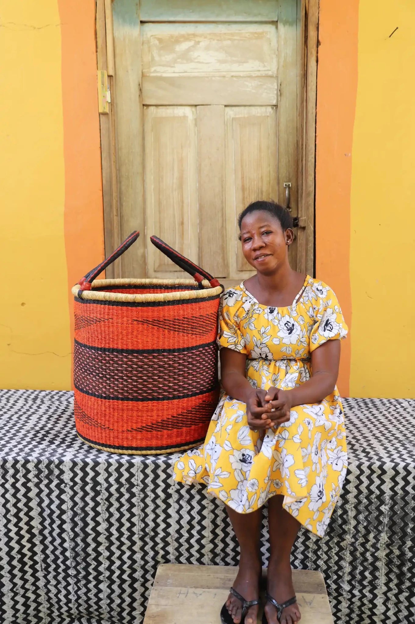 Open Laundry Basket (Large) by The Baba Tree. Handwoven elephant grass storage with leather handles. Bolgatanga artisan decor.